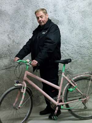 Michael Peldt uses an old bike to ride down the tunnel 