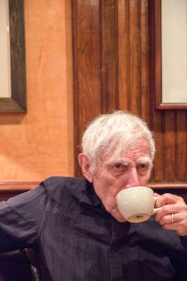 Revered designer Bob Gill sipping coffee