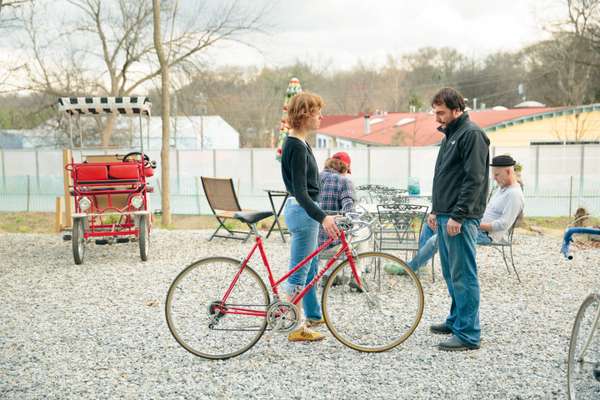 Atlanta Beltline Bicycles owner Benjamin Stimis consults a customer