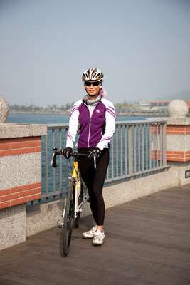 Cyclist on a bike path near the former British Consulate at Takao