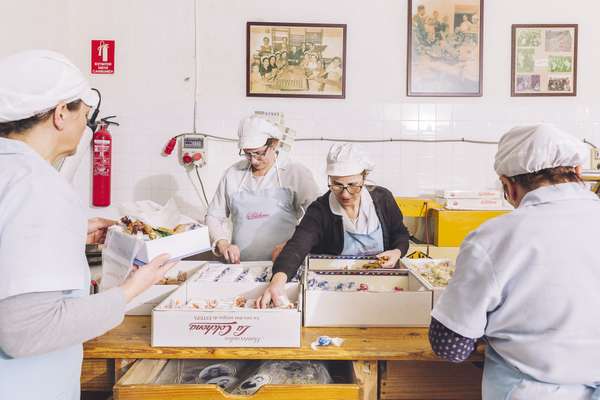 ‘Mantecado’ sweets being individually wrapped and arranged into presentation boxes at the La Colchona factory  