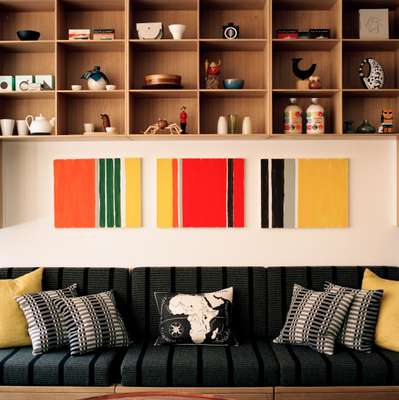 A custom-built bookcase and sofa system from Rud. Rasmussen, designed in 1928 by Mogens Koch, takes up one wall of the editor-in-chief’s outer meeting room