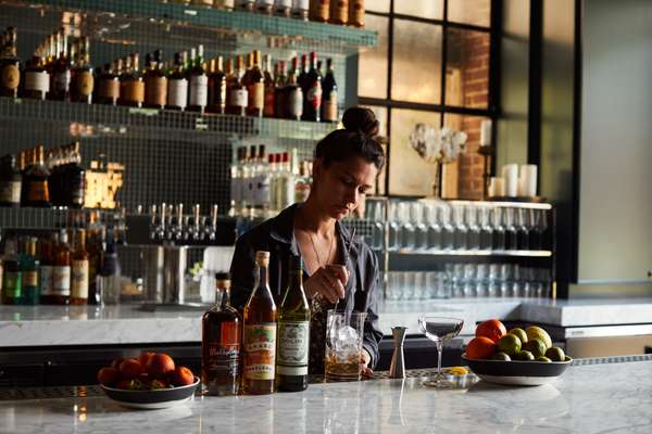 Mixing drinks at the Firehouse’s bar