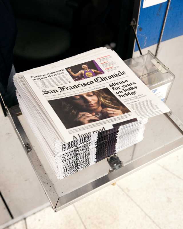 Copies at a newsstand inside Montgomery Street Station