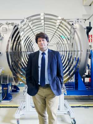 Jose Gonzalez del Amo, head of electric propulsion, in front of the thruster chamber