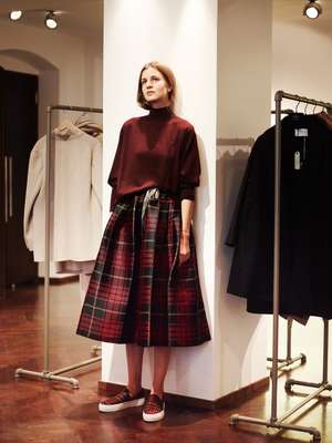 Lea models a skirt and sweater by Sofie D'Hoore