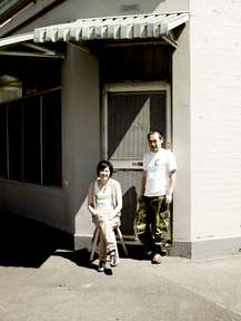 Meg and Zenta Tanaka outside their home, a converted milk bar 