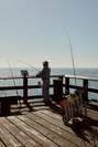 Fisherman casting his line from the Santa Barbara pier