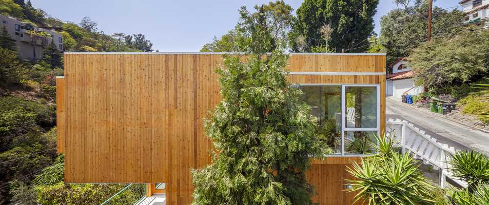 The homes are clad in cedar