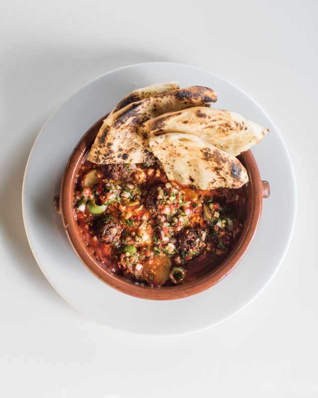 Lamb kefta topped with pickled chilli relish and homemade flatbread