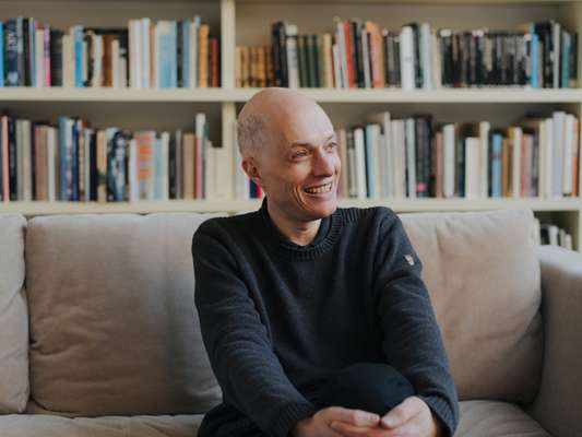 Alain de Botton in his London home