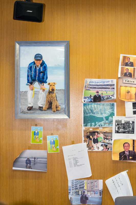 Ishizaki's office walls are papered with photographs