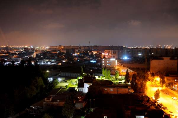 The city by night, looking out to the old citadel 