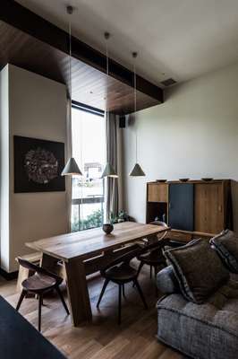 The Kitchen Suite has a dining table with Japanese chairs and lampshades from New Light Pottery in Nara