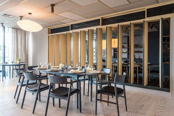 Dining room with Jari table; chairs by Naoto Fukasawa for Maruni and Conde House 