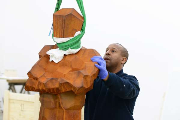 Danny Gayle handles Gormley's sculpture