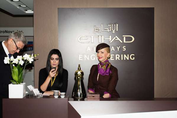 Etihad flight attendant (right) and colleagues ready to host potential customers