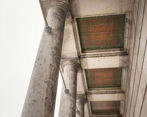 The portico ceiling reveals remnants of a Nazi past