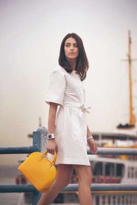 Dress by Loewe, bag by Louis Vuitton, watch by Gucci, bracelet by Hermès