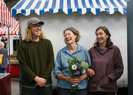 Sarah Hunter, founder of flower business Keeping the Plot, with daughter Connie and her husband Tom Booth