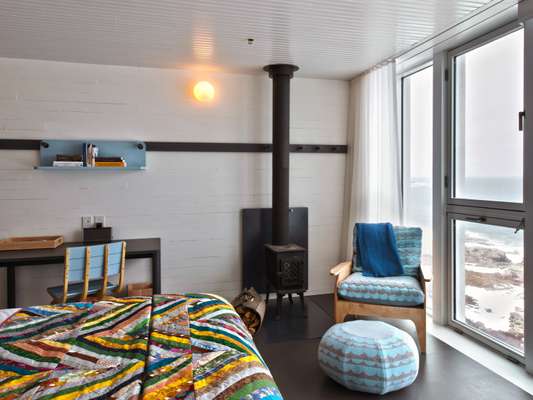 Bedroom at the inn. Everything bar the ‘Kachelöfen’ was created on Fogo, a product of collaborations between islanders and Canadian and European designers