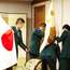 GSDF staff setting up the meeting room with flags