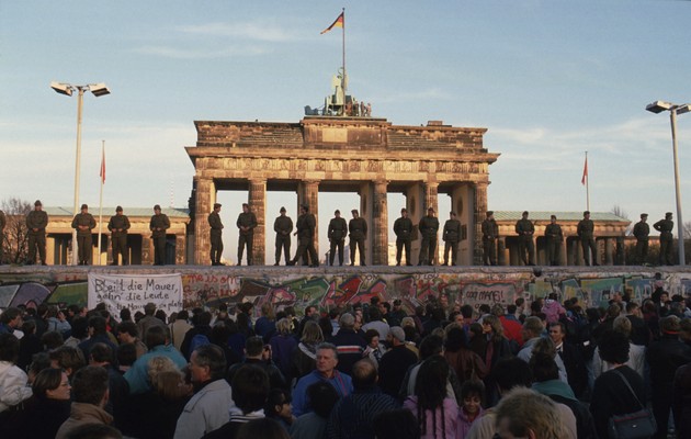 9 November 1989: Border guards of the German Democratic Republic observing demonstrations on the day the Berlin Wall was demolished