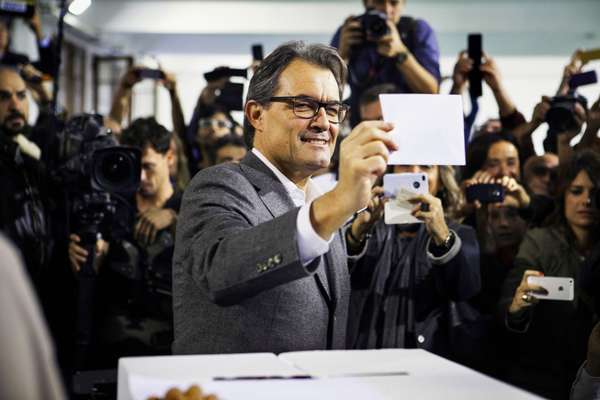 The then president of Catalonia, Artur Mas, casting his vote on 9 November in Barcelona. This symbolic poll on secession was held after the Constitutional Court suspended its plans for an official independence referendum.