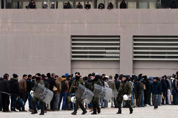 11 December 2015: Riot police and migrants in Athens