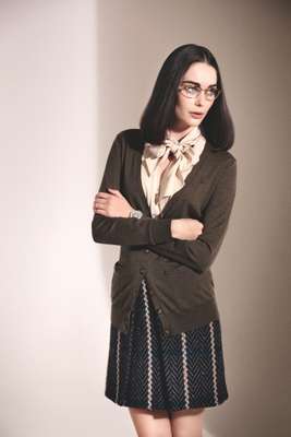 Glasses by Oliver Peoples, cardigan by Ralph Lauren, shirt by Beymen, skirt by Bally, watch by Patek Philippe