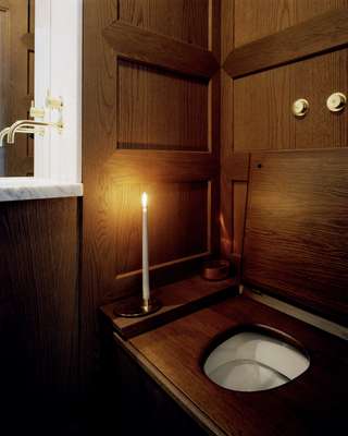 The smallest rooms are entirely wood-panelled with old-fashioned water closets, marble basins and brass fixtures 