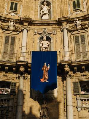 One of Marinella Senatore’s tapestries hung at the Quattro Canti 