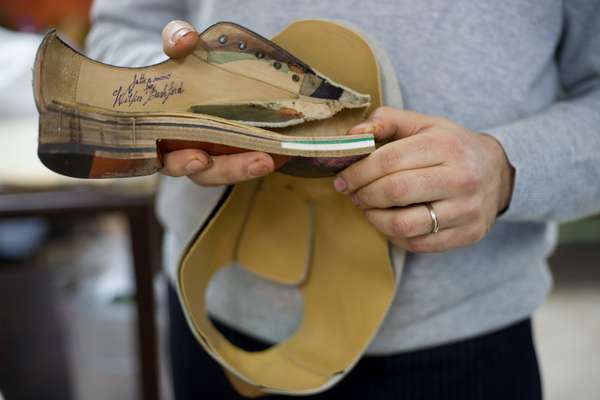 Cut-out of a shoe: the green rubbery substance is poron, a foam developed by Nasa that cushions the feet