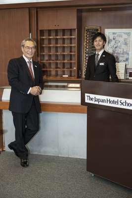 President Tsutomo Ishizuka (left) in a classroom