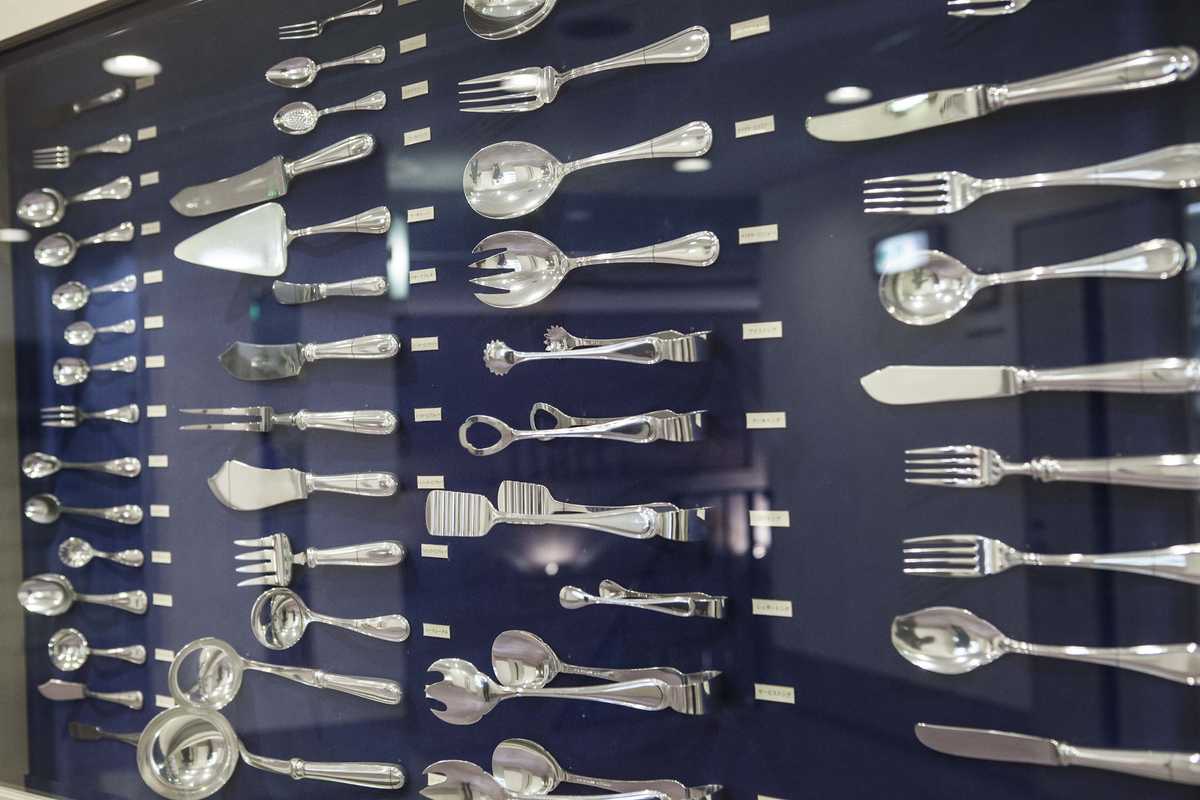 Full cutlery set displayed on the wall