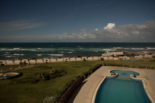 The hotel overlooks Libya’s Mediterranean coastline. Until recently the poolside was a popular hangout for diplomats and elite Libyans