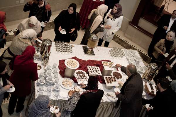 Participants tucking into desserts after a workshop against gender violence 