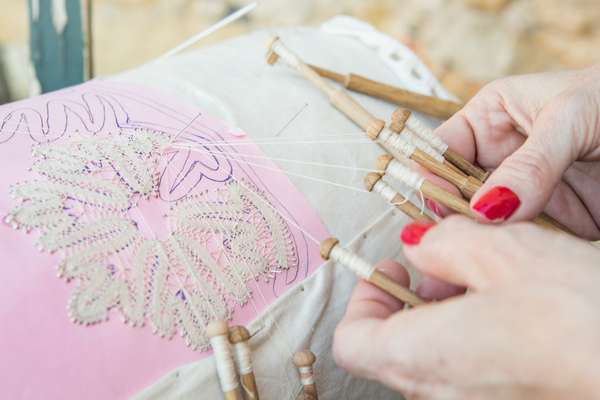 Practising art of Cretan bobbin lace