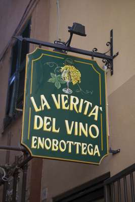 Wine shop sign in downtown Genoa by Berra