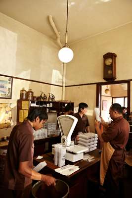 Packing coffee at Kopi Aroma