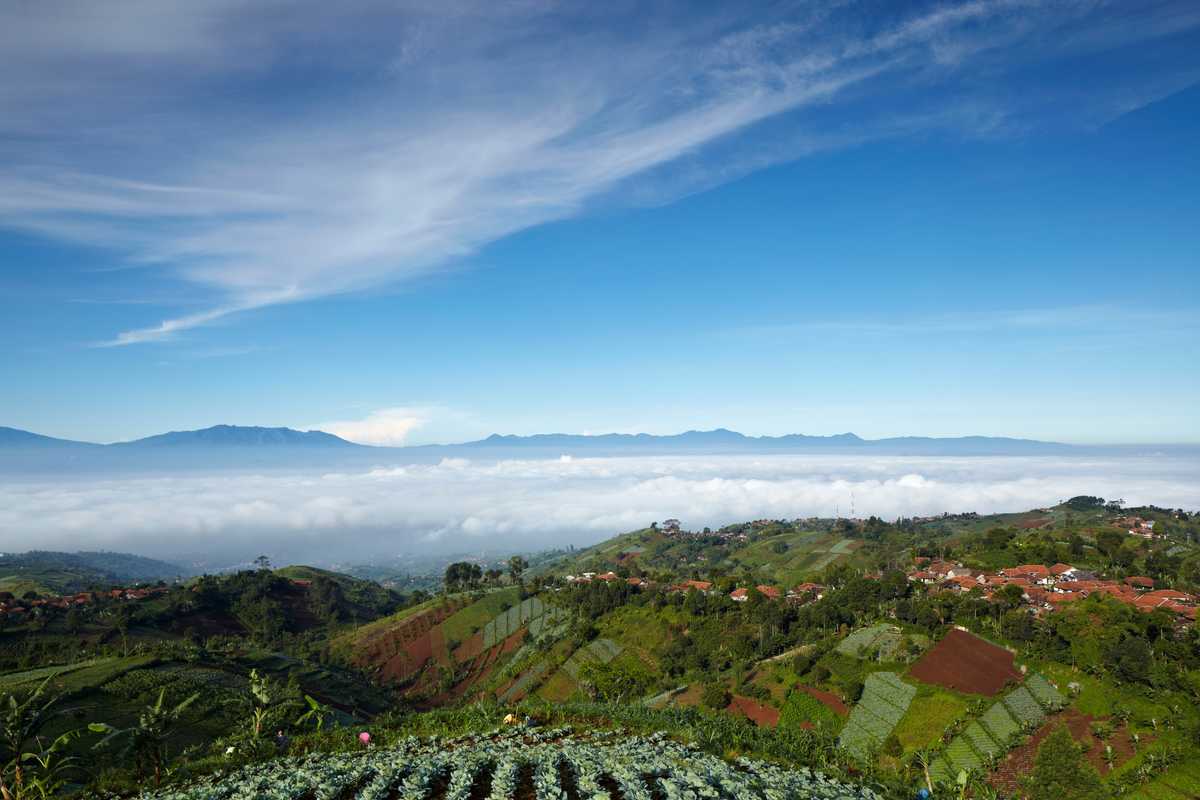 Bandung lies in a volcanic basin and is surrounded by fertile hills