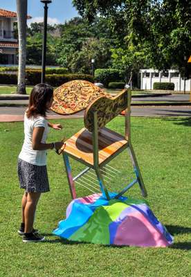 Student of visual arts preparing her work for an expo