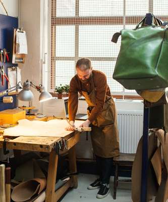 Jonatan Staniec has a rent-free space in the factory to make his leather products