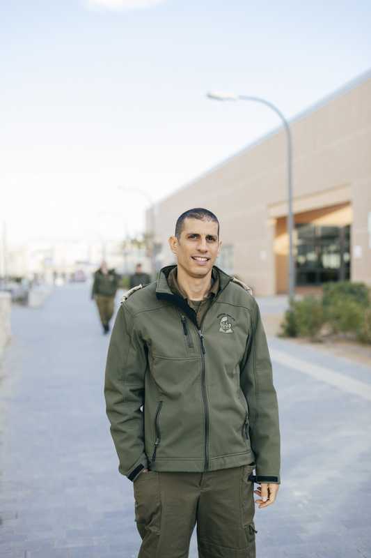 Dror Malal, an IDF driving instructor, in front of the School of Logistics