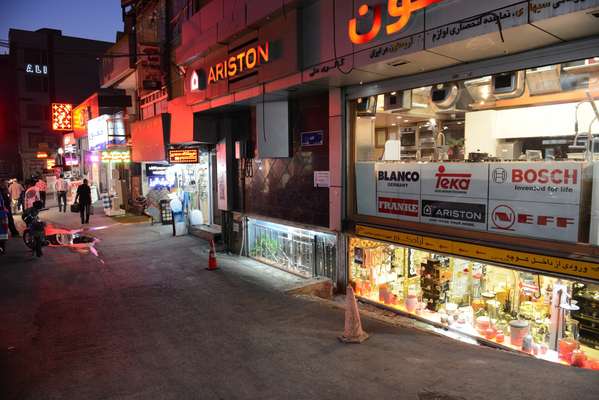 A street at night off Shiraz Avenue in North Tehran where kitchen and bathroom suites are sold