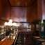 Bar with teak panelling and Giacometti lamp
