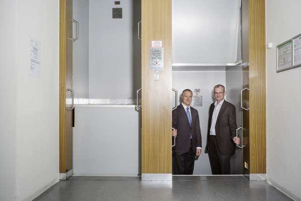 ThyssenKrupp Elevator's CEO Andres Schierenbeck (left) and Markus Jetter, head of research, in the firm's paternoster lift
