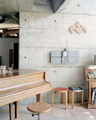 Cosy corner with an unsigned Hans Arp wooden sculpture on the wall