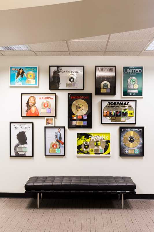 Gold and platinum discs on the wall at CCMG headquarters 