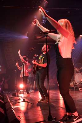 Kari Jobe and Cody Carnes onstage as part of The Belonging